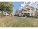 Two-story brick home with a front porch and landscaped yard at 4348 Meadow Vista Dr, Stonecrest, GA 30038