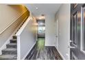 Bright and spacious entryway with staircase and wood-look floors at 1970 Millstream Holw, Conyers, GA 30012