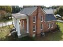 Brick home with a wraparound porch and columns at 3021 Stone Mountain St, Lithonia, GA 30058