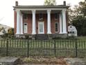 Historic brick home with classic columns at 3021 Stone Mountain St, Lithonia, GA 30058