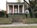 Historic brick home with a grand entrance at 3021 Stone Mountain St, Lithonia, GA 30058