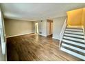 Living room with wood-look floors and staircase at 6354 Shannon Pkwy # 30C, Union City, GA 30291