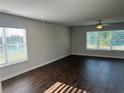 Spacious living room featuring hardwood floors and large windows at 3270 Forest Green Dr, Douglasville, GA 30135