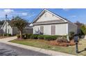 Single-story house with a two-car garage and nicely landscaped yard at 307 Jessica Way, Canton, GA 30114