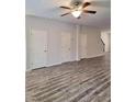 Spacious living room with LVP flooring and ceiling fan at 1535 Iris Walk, Jonesboro, GA 30238