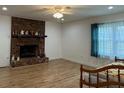 Spacious living room featuring a brick fireplace and hardwood floors at 2194 Klondike Sw Rd, Conyers, GA 30094
