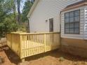 Small wooden deck with railing next to the house at 2961 Hawk Se Ct, Marietta, GA 30067