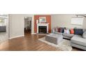 Living room with hardwood floors, fireplace and gray sectional sofa at 741 Anderson Walk, Marietta, GA 30062