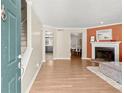 Living room with hardwood floors, fireplace, and access to kitchen at 741 Anderson Walk, Marietta, GA 30062