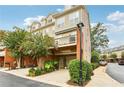 Exterior view of townhome with parking and landscaping at 1122 Providence Pl, Decatur, GA 30033