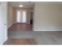 Spacious living room with carpet and french doors at 8060 Northcrest Dr, Jonesboro, GA 30238