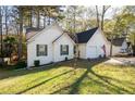 White sided home with a two-car garage at 3977 Sharon Spgs, Powder Springs, GA 30127