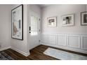 Bright entryway with wood-look floors and wainscoting at 520 Lanier Way, Temple, GA 30179