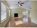 Bright living room featuring hardwood floors and a fireplace at 132 Bishop Nw Rd, Cartersville, GA 30121