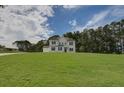 Two-story house exterior with white siding, gray shutters, and a lush lawn at 107 Prescott Manor Dr, Canton, GA 30115