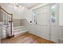 Bright entryway with hardwood floors and staircase at 5417 Trentham Dr, Dunwoody, GA 30338