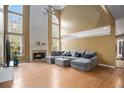 Spacious living room with hardwood floors and fireplace at 9140 N Links Dr, Covington, GA 30014