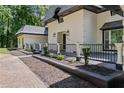 Front porch with black railings, planters, and ample space at 2023 Stoneleigh Dr, Stone Mountain, GA 30087