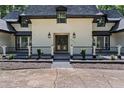 Elegant entryway with double iron doors and a spacious porch at 2023 Stoneleigh Dr, Stone Mountain, GA 30087