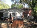 Backyard with deck, brick grill, and partially wooded area at 1318 Shoreham Dr, Atlanta, GA 30349