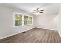 Spacious living room with hardwood floors and large windows at 2435 Wood Valley Dr, Atlanta, GA 30344