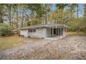 Ranch style home with covered carport and spacious lawn at 3449 Misty Valley Rd, Decatur, GA 30032