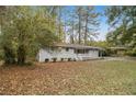 Gray ranch house with red door and carport at 3449 Misty Valley Rd, Decatur, GA 30032