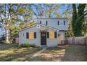Two-story house with gray siding, updated windows, and a small front yard at 1870 S Columbia Pl, Decatur, GA 30032