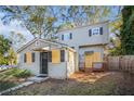 Two-story house with gray siding, updated windows, and a small deck at 1870 S Columbia Pl, Decatur, GA 30032