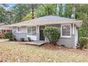 Charming ranch home with gray siding and a black door at 2604 Harmony Way, Atlanta, GA 30344