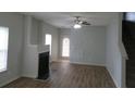 Living room with fireplace and hardwood floors at 6511 Grey Fox Way, Riverdale, GA 30296