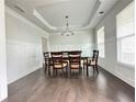 Formal dining room featuring hardwood floors and elegant chandelier at 3781 Heirloom Loop Ct, Buford, GA 30519