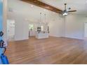 Open living room with hardwood floors and exposed beam at 1815 Arkose Dr, Atlanta, GA 30316