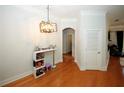 Bright dining area with hardwood floors and modern chandelier at 799 Hammond Dr # 116, Atlanta, GA 30328