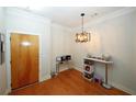 Bright dining area with hardwood floors and modern chandelier at 799 Hammond Dr # 116, Atlanta, GA 30328