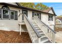 Two-story house with double garage and walkway at 39 Indian Springs Ne Dr, Rydal, GA 30171