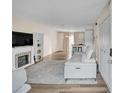 Living room with fireplace, wood floors, and view of kitchen at 4701 Flat Shoals Rd # 54C, Union City, GA 30291