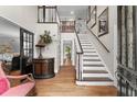 Two-story entryway with hardwood floors and staircase at 4250 Edgewater Nw Ct, Kennesaw, GA 30144