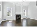 Spacious living room with dark hardwood floors and a fireplace at 2313 Attaway Ne Walk, Brookhaven, GA 30319