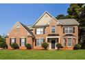 Two-story home with brick facade and black shutters at 105 Argonne Dr, Fayetteville, GA 30214