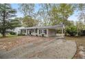 House with carport and large yard at 6940 Kimberly Mill Rd, Atlanta, GA 30349