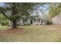 Single-story home with landscaping at 6940 Kimberly Mill Rd, Atlanta, GA 30349