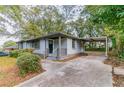 Front view of the house with a carport and driveway at 2191 Miriam Ln, Decatur, GA 30032