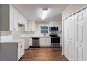 Renovated kitchen featuring white cabinets and stainless steel appliances at 2191 Miriam Ln, Decatur, GA 30032
