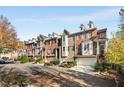 Multiple townhouses with attached garages and fall foliage at 226 Mclaren Gates Dr, Marietta, GA 30060
