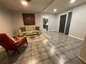 Living room with tiled floors, a couch and an armchair at 3759 Stanford Cir, Decatur, GA 30034