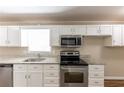 Kitchen with granite countertops and stainless steel appliances at 160 Cross Creek Pkwy, Dallas, GA 30157