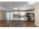Kitchen with granite island, stainless steel appliances at 160 Cross Creek Pkwy, Dallas, GA 30157