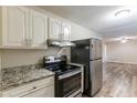 Modern kitchen featuring stainless steel appliances and granite countertops at 3730 Douglas Ridge Trl, Douglasville, GA 30135