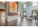 Two-story living room with hardwood floors, high ceilings, and an open floor plan at 1411 Splitrock Sw Pl, Atlanta, GA 30331